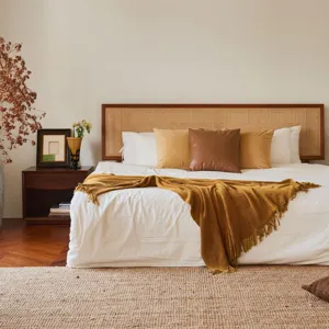 Cozy mustard yellow knitted throw blanket with fringe for sofa and bed bedroom decor style.