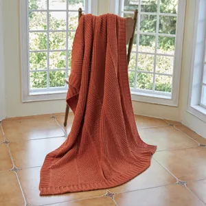 Knitted throw blanket with elegant diagonal stripe design, perfect for sofa, bed, and office use.