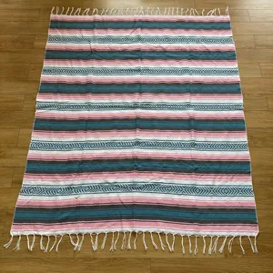 Mexican style woven fringe blanket, geometric striped cotton picnic mat and beach towel.