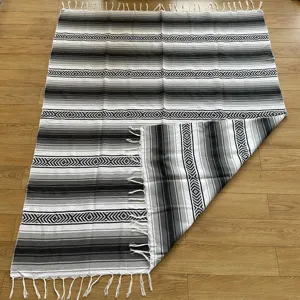 Mexican style woven fringe blanket, black and white striped boho throw for beach and picnic.