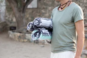 Detailed view of woven Mexican style fringe blanket for beach towel and picnic use.