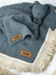 Grey infant gauze blanket with fringe and cute bunny toy, soft newborn swaddle wrap.