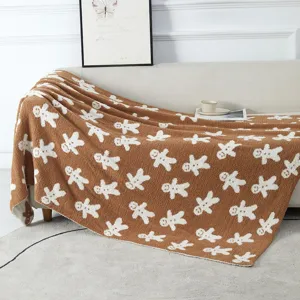 Cozy brown gingerbread man pattern fleece blanket, soft textured throw for sofa and living room.
