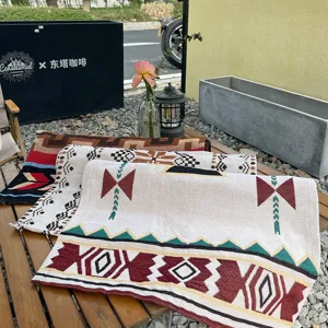 Detailed view of Bohemian woven jacquard camping blankets and table runners with geometric patterns.