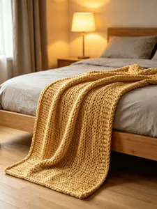 Chunky knit throw blanket texture close-up detail cozy yellow wool blanket for sofa and bed decor