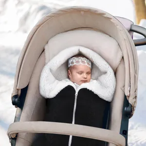 Knitted baby sleeping bag and stroller blanket detail, cozy double-layer winter design.