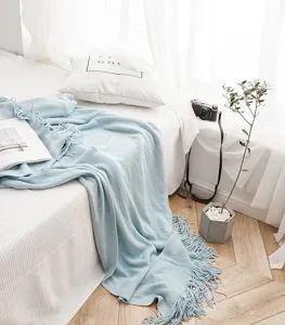 Nordic solid color knitted throw blanket detail shot, light blue tassel sofa bed decor blanket.