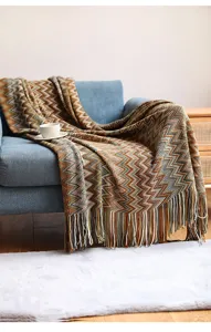 Detailed view of bohemian knitted fringe throw blanket for sofa and office nap use.