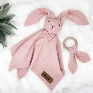 Cute pink baby security blanket with bunny ears and wooden teether, soft cotton gauze lovey.