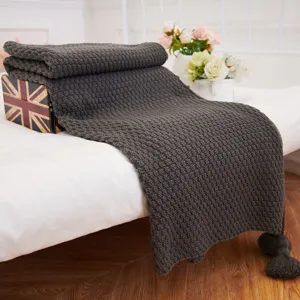 Dark grey knitted throw blanket with tassels, cozy pineapple texture sofa blanket for home.