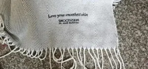 Woven herringbone throw blanket with fringe, cozy acrylic jacquard blanket for home decor.