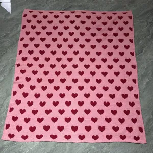 Pink heart pattern microfiber plush blanket for cozy home decor and Valentine gift.