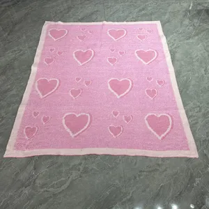 Pink knitted heart pattern blanket, cozy soft throw for home living room decor and warm bedroom.