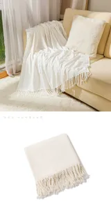 Cozy knitted throw blanket with fringe detail, soft home decor for sofa bed and living room.