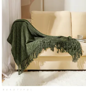 Green knitted fringe blanket for sofa throw, cozy chenille blanket for home decor.