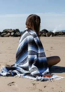 Detailed view of the woven diamond jacquard Mexican beach blanket for outdoor use.