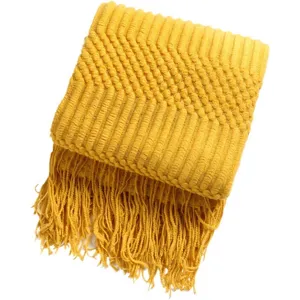 Yellow knit throw blanket with fringe, cozy soft sofa blanket for home bedroom decor.