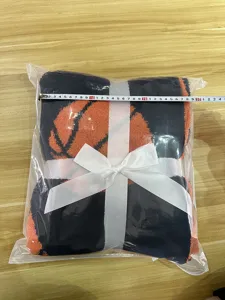Knitted basketball jacquard blanket throw, soft semi-velvet material with ribbon packaging.