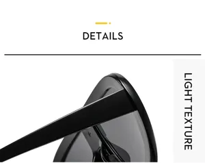 Detailed view of stylish oversized black sunglasses showing glossy frame and lightweight temple design.