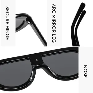 Close-up detail of stylish black oversized flat-top sunglasses showing hinge and temple.