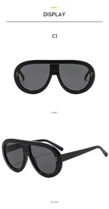 Black oversized oval sunglasses with stylish gold hardware details, front and side view.
