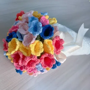 Handcrafted crochet flower bouquet close up detail showing colorful wool yarn floral design.
