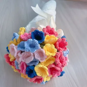 Handcrafted crochet flower bouquet blanket detailed shot showing colorful floral design and wrapping.
