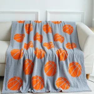 Grey soft plush throw blanket with orange basketball pattern, cozy and warm for sofa bed use.