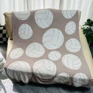 Soft fuzzy throw blanket with woven volleyball pattern, cozy knit flannel bed and couch cover.