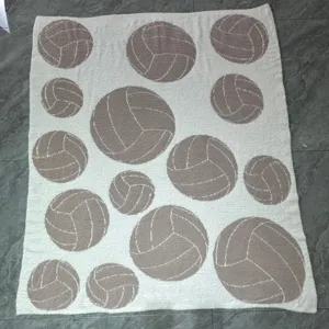 Soft plush throw blanket with stylish ball pattern, comfortable knitted home textile bed cover.