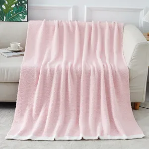 Detailed view of soft pink fluffy knit blanket, cozy home decor plush throw blanket for bed.