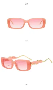 Detailansicht retro quadratische rosa Farbverlauf Sonnenbrille mit wellenförmigen goldenen Bügeln.