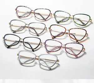 Gafas cat-eye de metal con monturas coloridas para moda callejera diaria y estilo moderno.