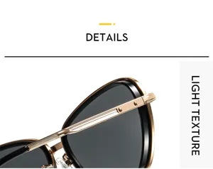 Primer plano detallado de gafas de sol con montura metálica, textura fina y lentes oscuras.
