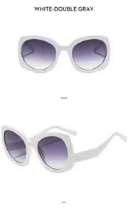 Vista detallada de elegantes gafas de sol blancas con lentes grises y montura gruesa.