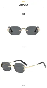 Gafas de sol poligonales sin montura con bisagras de metal para uso diario en exteriores.
