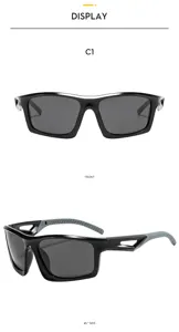 Detailed view of sports sunglasses featuring black frame grey lenses and side ventilation.