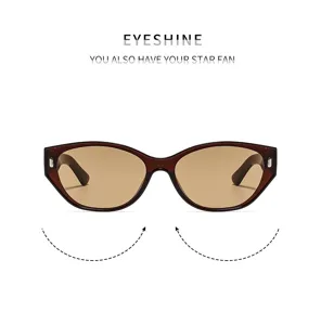 Lunettes de soleil rétro cat-eye pour femme avec verres dégradés et détails métalliques.