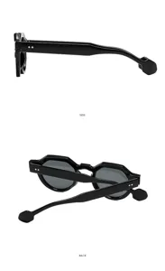 Detail view of black polygon fashion sunglasses showing unique temple design and side profile.