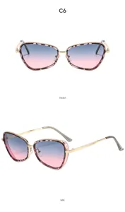 Elegantes gafas de sol de ojo de gato con montura metálica y un gran degradado.