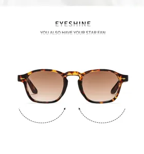 Gafas de sol carey clásicas con lentes degradadas marrones y detalles de flecha metálica.