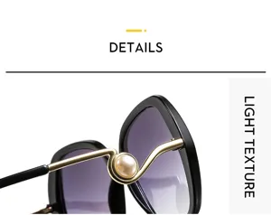 Close-up detail shot of women sunglasses featuring elegant pearl and metal wave design.