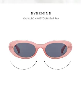 Stylish pink oval sunglasses for women, retro acetate frame with cool dark lenses.