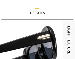 Women fashion sunglasses detail view, chic black frame with golden temple accent.