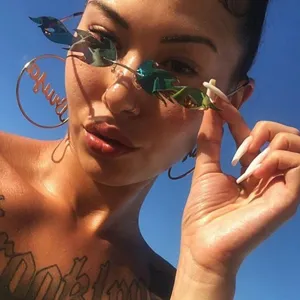 Chic rimless flame sunglasses for women, trendy colorful metallic eyewear daily use.