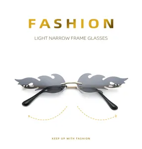 Detail view of trendy rimless flame sunglasses featuring unique grey gradient lenses.