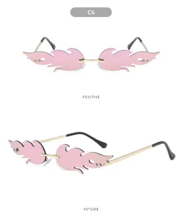 Rimless flame sunglasses with pink gradient lenses and gold temples for women stylish look.