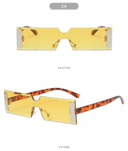 Vue détaillée de lunettes de soleil rectangulaires plates tendance avec verres jaunes et accents.