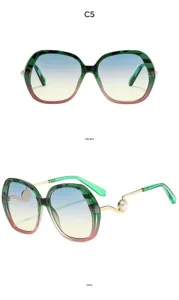 Oversized gradient sunglasses for women featuring stylish pearl and gold temple decoration.