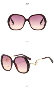 Women oversized gradient sunglasses with pearl decor on gold temples, elegant detail view.